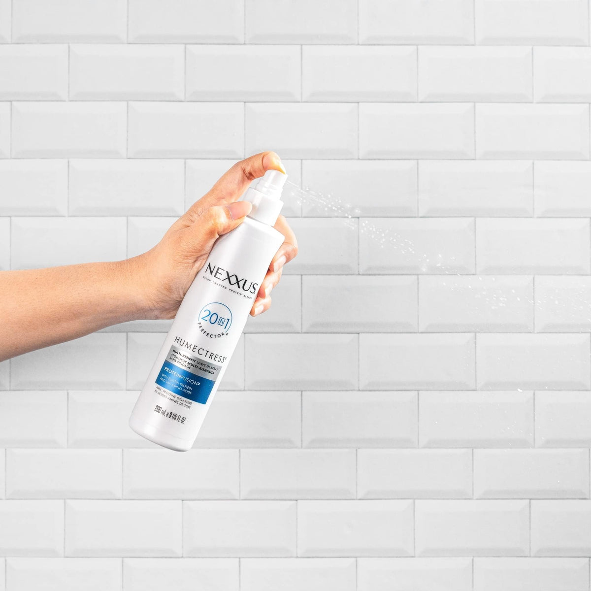 Nexxus application on styled curls showing frizz control and definition benefit