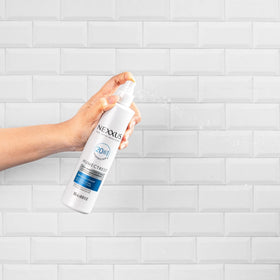 Nexxus application on styled curls showing frizz control and definition benefit