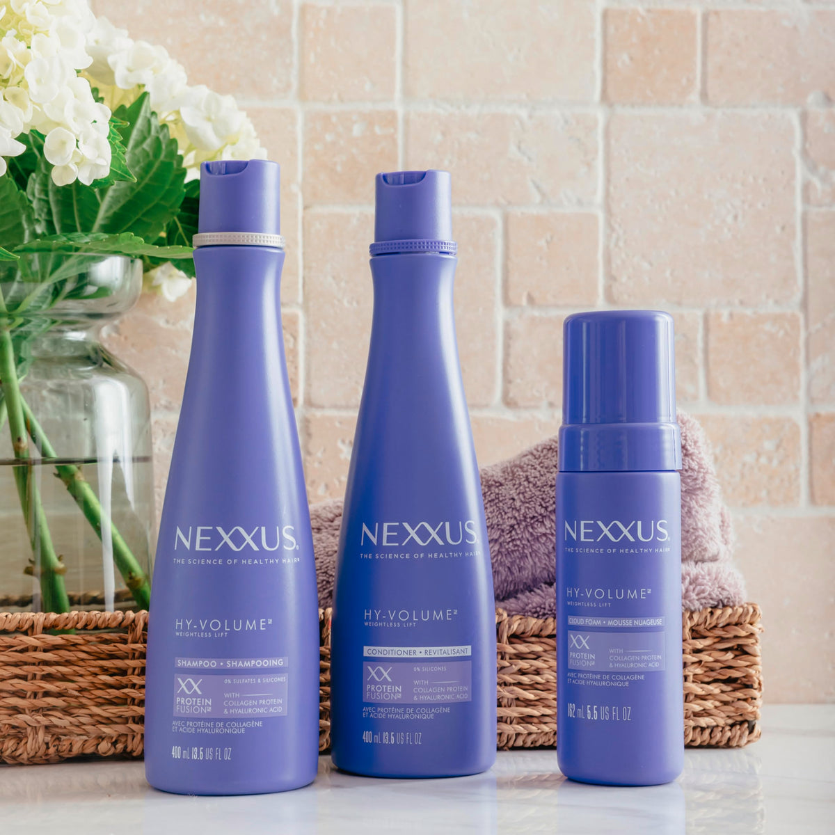 Nexxus HY-VOLUME styled blowout on model showing visible body and salon-like lift benefit