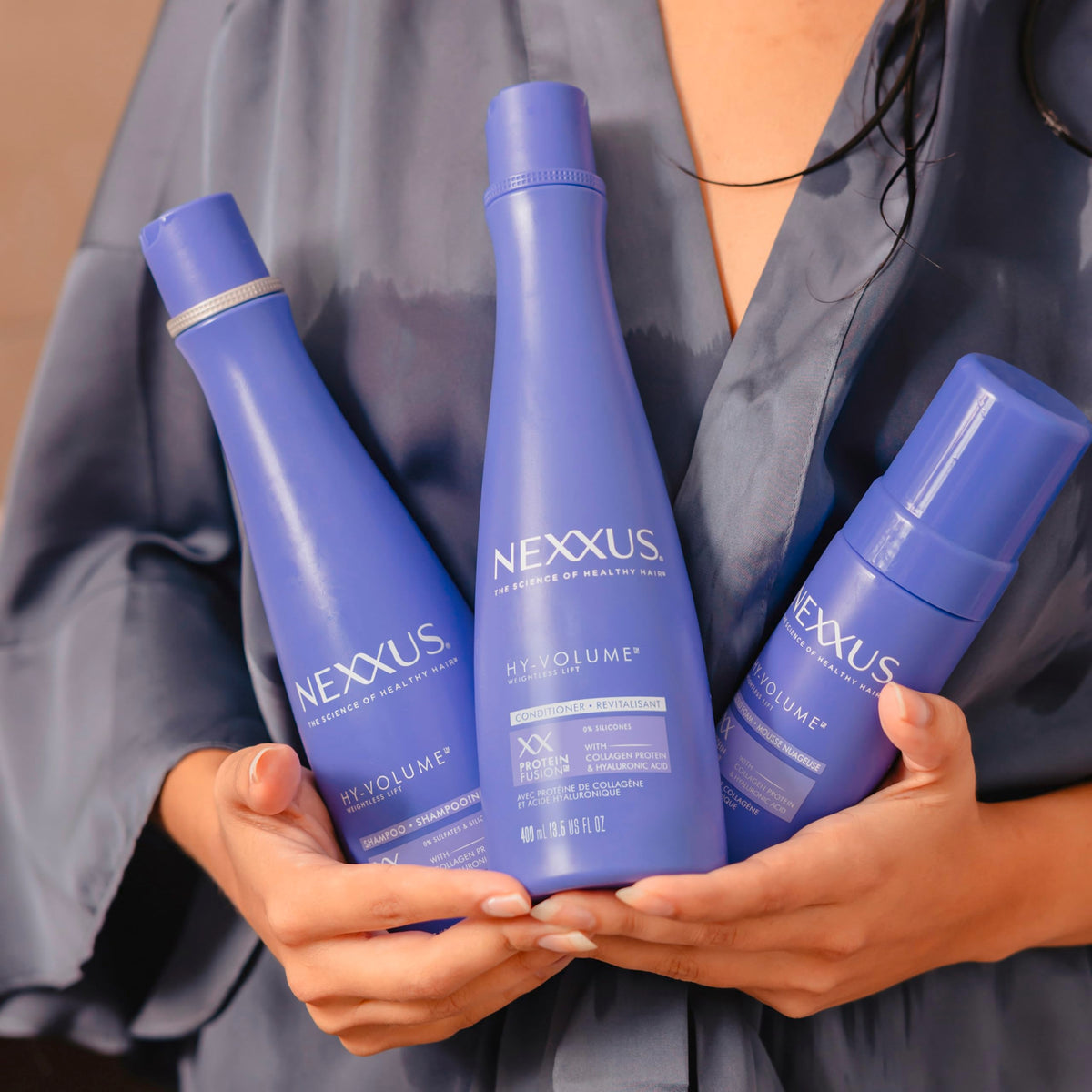 Nexxus HY-VOLUME size comparison with ruler showing 13.5 fl oz and 5.5 fl oz sizes for value benefit