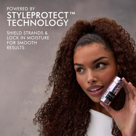 Nexxus slick stick in hand size comparison shows portable design for on-the-go touch-ups benefit