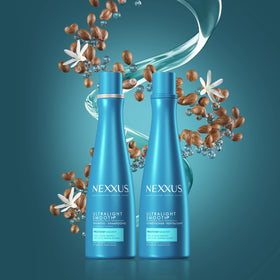 Nexxus bottles in hand for scale illustrating travel-friendly 13.5 oz size