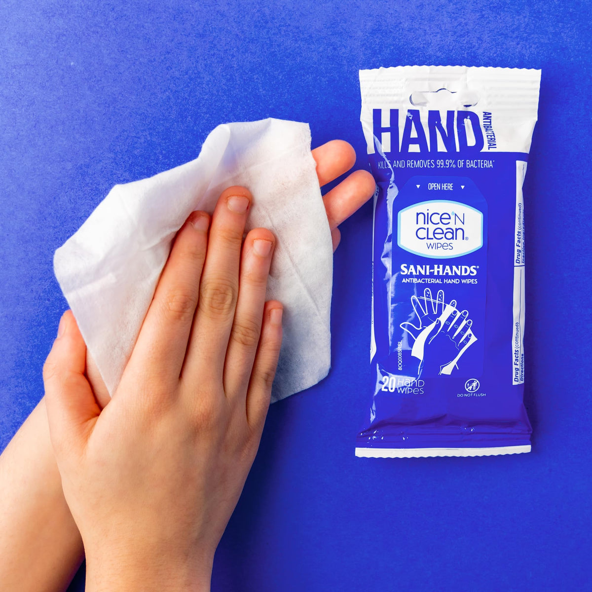 Nice 'N Clean wipe in hand demonstrating gentle feel and effective cleaning