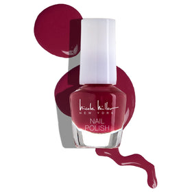 Nicole Miller mini bottles next to ruler showing compact travel-friendly size