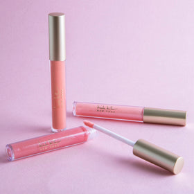 Nicole Miller New York open tube close-up highlighting applicator and glossy texture for smooth finish
