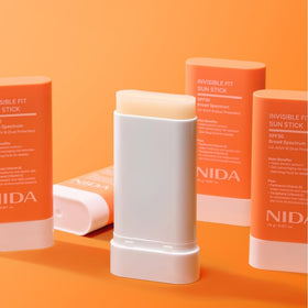 NIDA sun stick used outdoors on a walk showing portable sun protection benefit