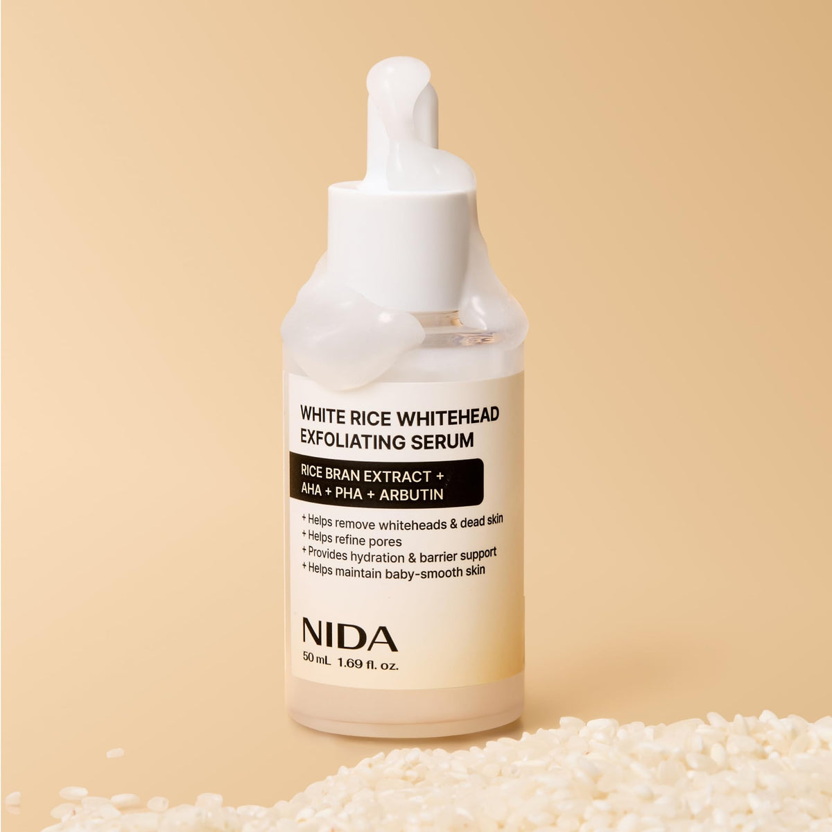 NIDA flatlay with rice bran and botanicals showing brightening ingredients