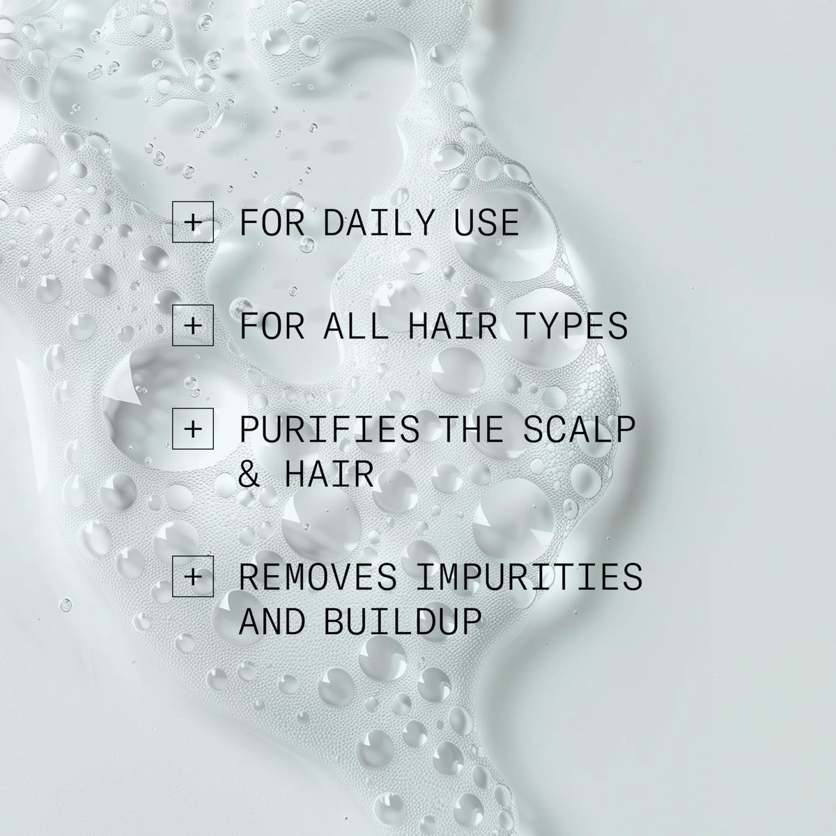 NIOXIN in-shower use with hand massaging scalp demonstrating thorough detox
