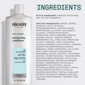 Nioxin bottle in bathroom setting conveying salon-quality scalp care benefit