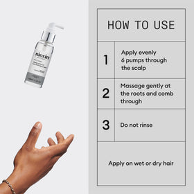 Nioxin Diamax in hand scale comparison illustrating travel-friendly 3.38 fl oz size