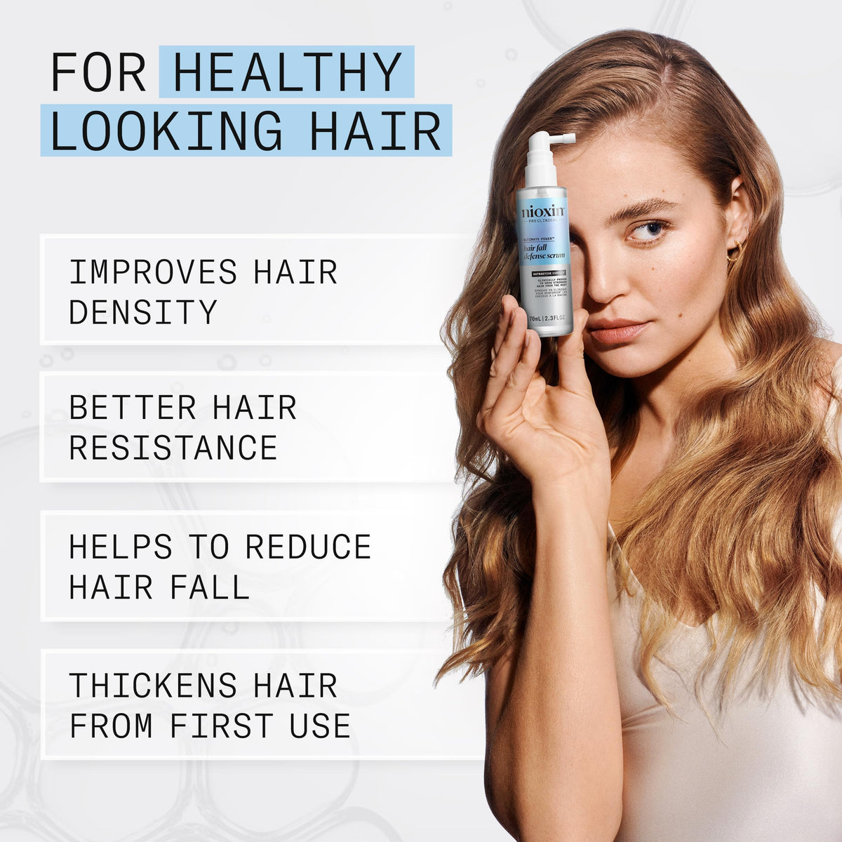 Nioxin lightweight serum texture on fingertip demonstrating non-greasy feel