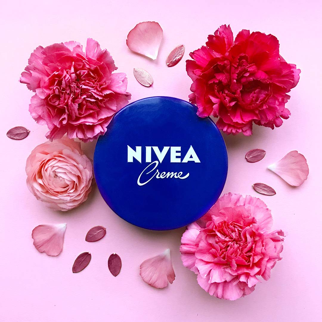 NIVEA creme tins arranged on bathroom shelf displaying convenience and readiness