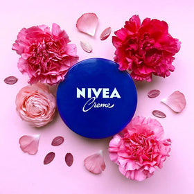 NIVEA creme tins arranged on bathroom shelf displaying convenience and readiness