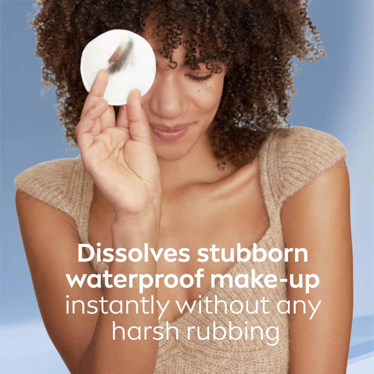 NIVEA pouring solution onto cotton pad for gentle eye make-up removal
