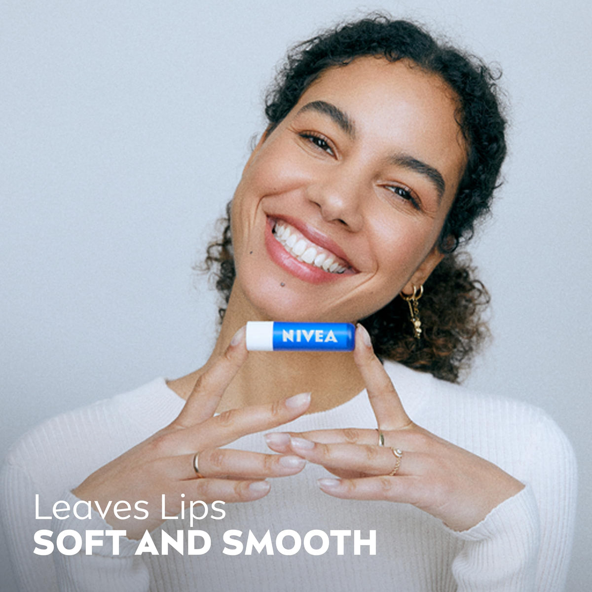 NIVEA hand cream tube in hand delivering portable hydration when needed
