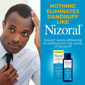 Nizoral size comparison with hand to show 14 fl oz volume benefit