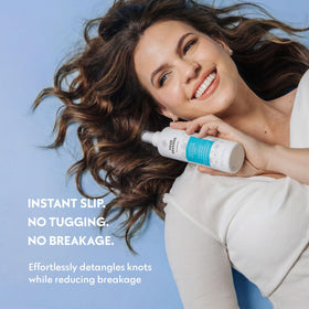 No nothing product mist visible on hair strand, showing lightweight non-greasy texture
