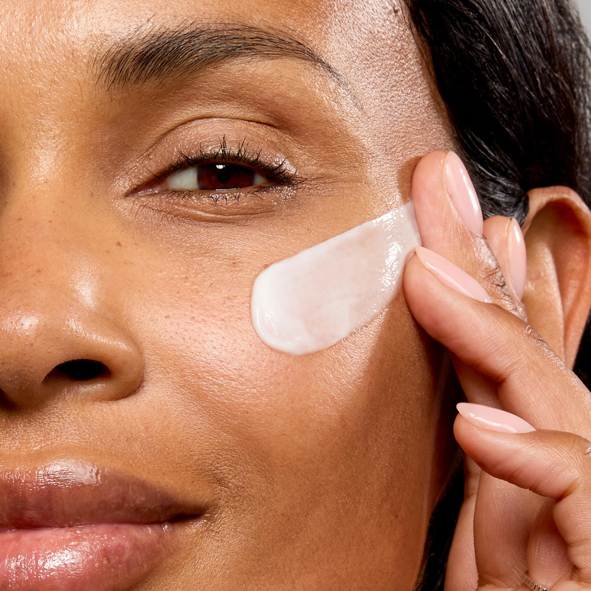 No7 cream being smoothed onto neck demonstrating firming and smoothing benefit