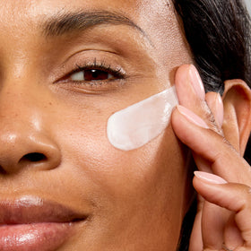 No7 cream being smoothed onto neck demonstrating firming and smoothing benefit