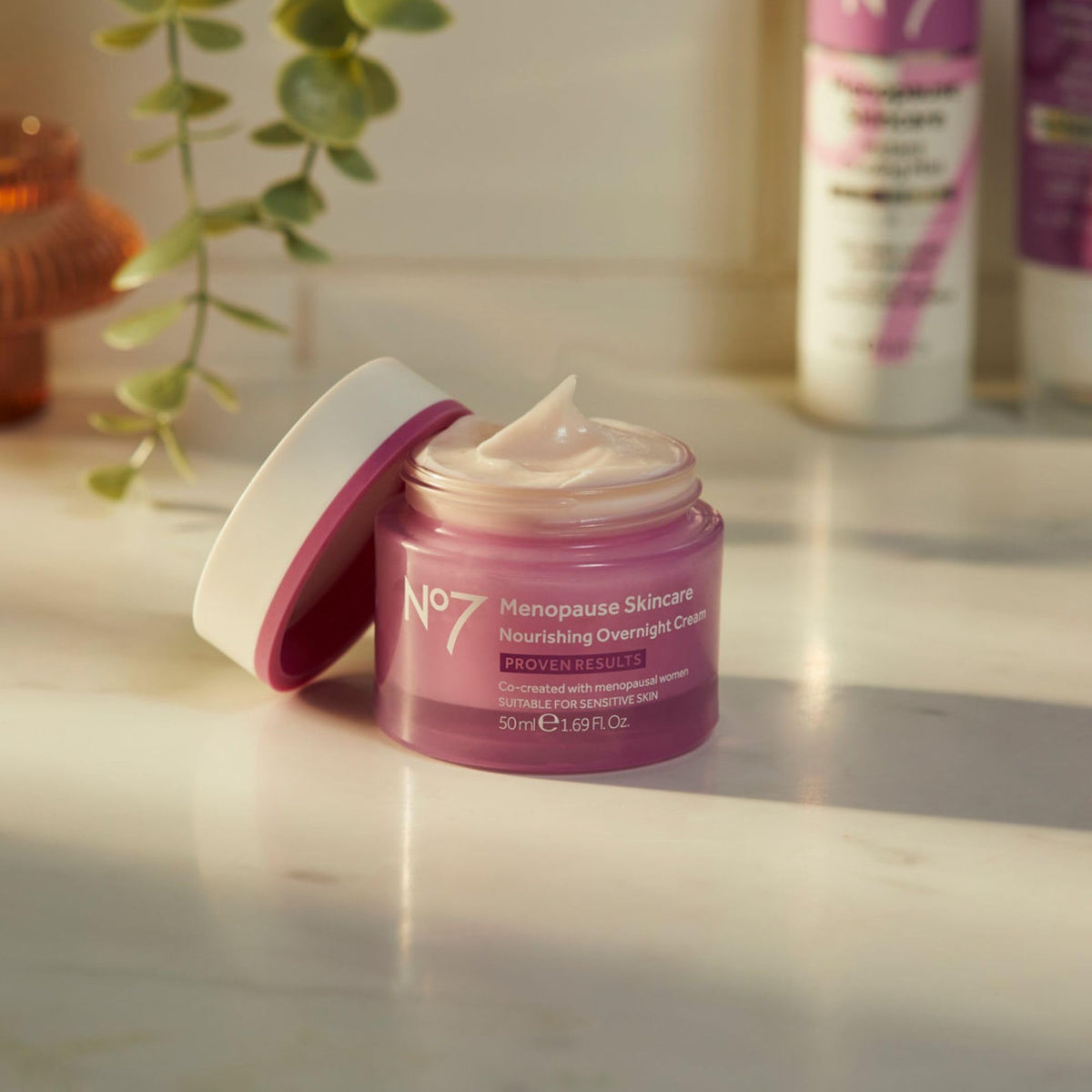 No7 50 ml jar beside a ruler size comparison conveying compact travel-friendly volume