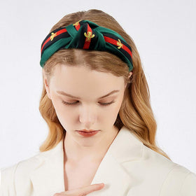 NODG headband beside ruler showing 2.5 inch width for full forehead coverage benefit