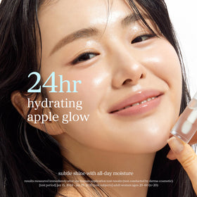 NOONI model applying lip oil for plumping, dewy pout benefit