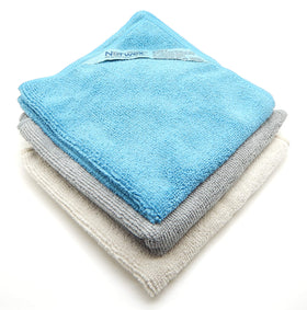 Norwex body pack coastal front view showing three colored cloths and compact packaging for convenience