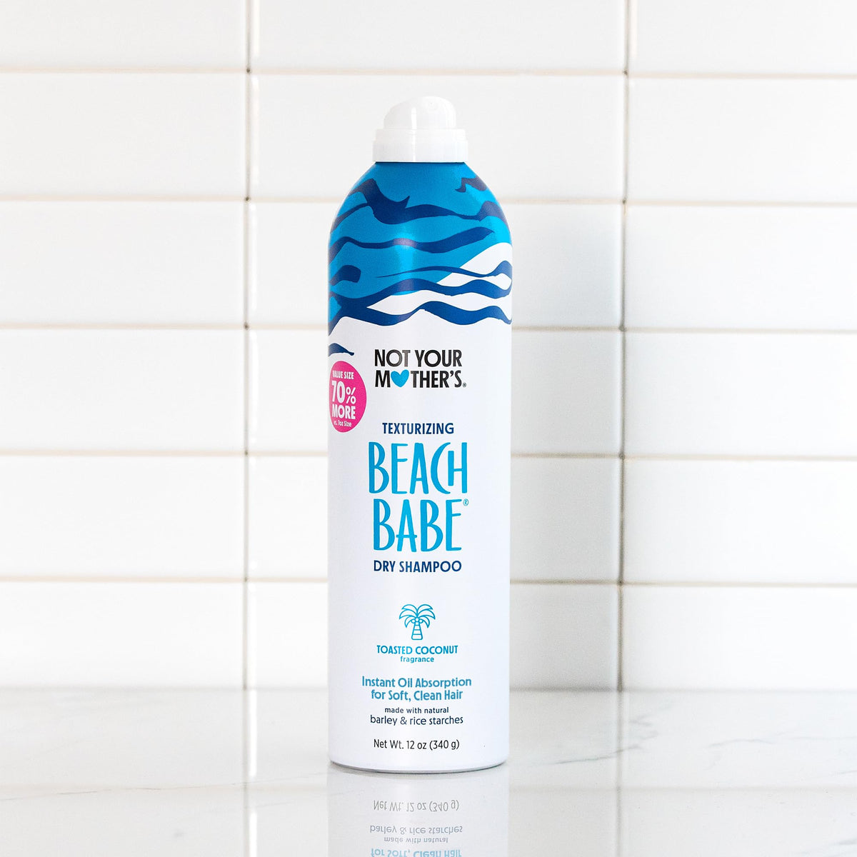 Not Your Mother's can held in hand to show size and generous number of uses
