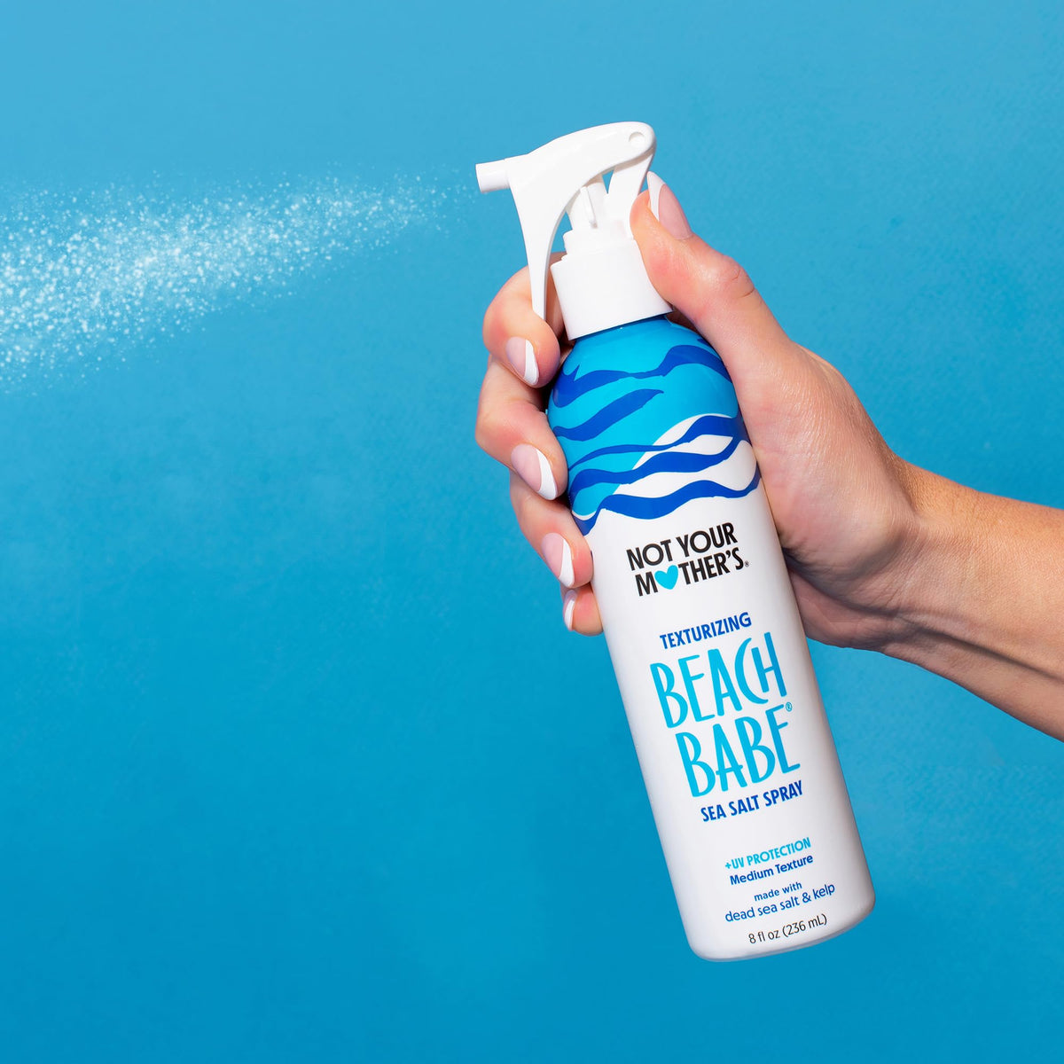 Not Your Mother's bottle used in salon setting creating effortless volume and grit