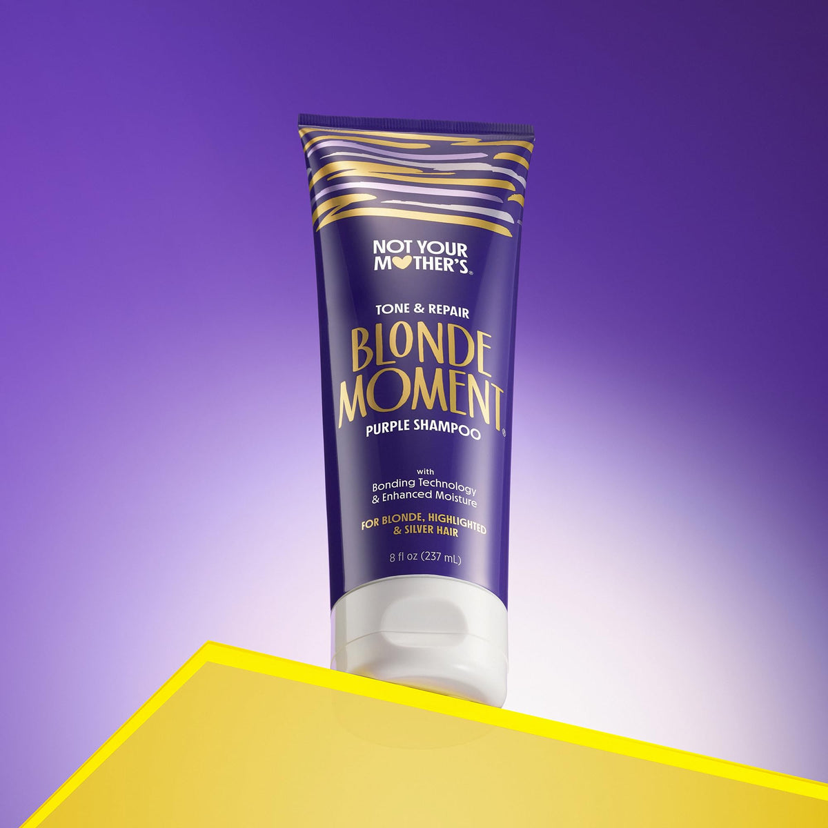 Not Your Mother's lather of purple shampoo in hand demonstrating toning action