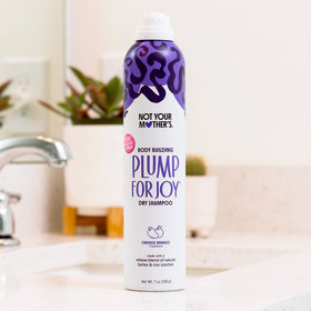 Not Your Mother's with orange and mango fruits highlighting bright, fresh fragrance