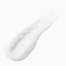 Not Your Mother's shampoo poured on hand demonstrating gentle cleansing benefit