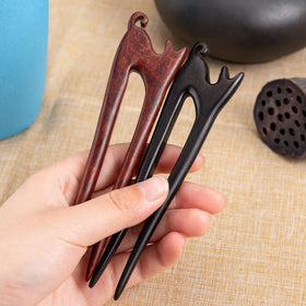 noverlife hair sticks inserted in bun showing stable hold and tidy finish