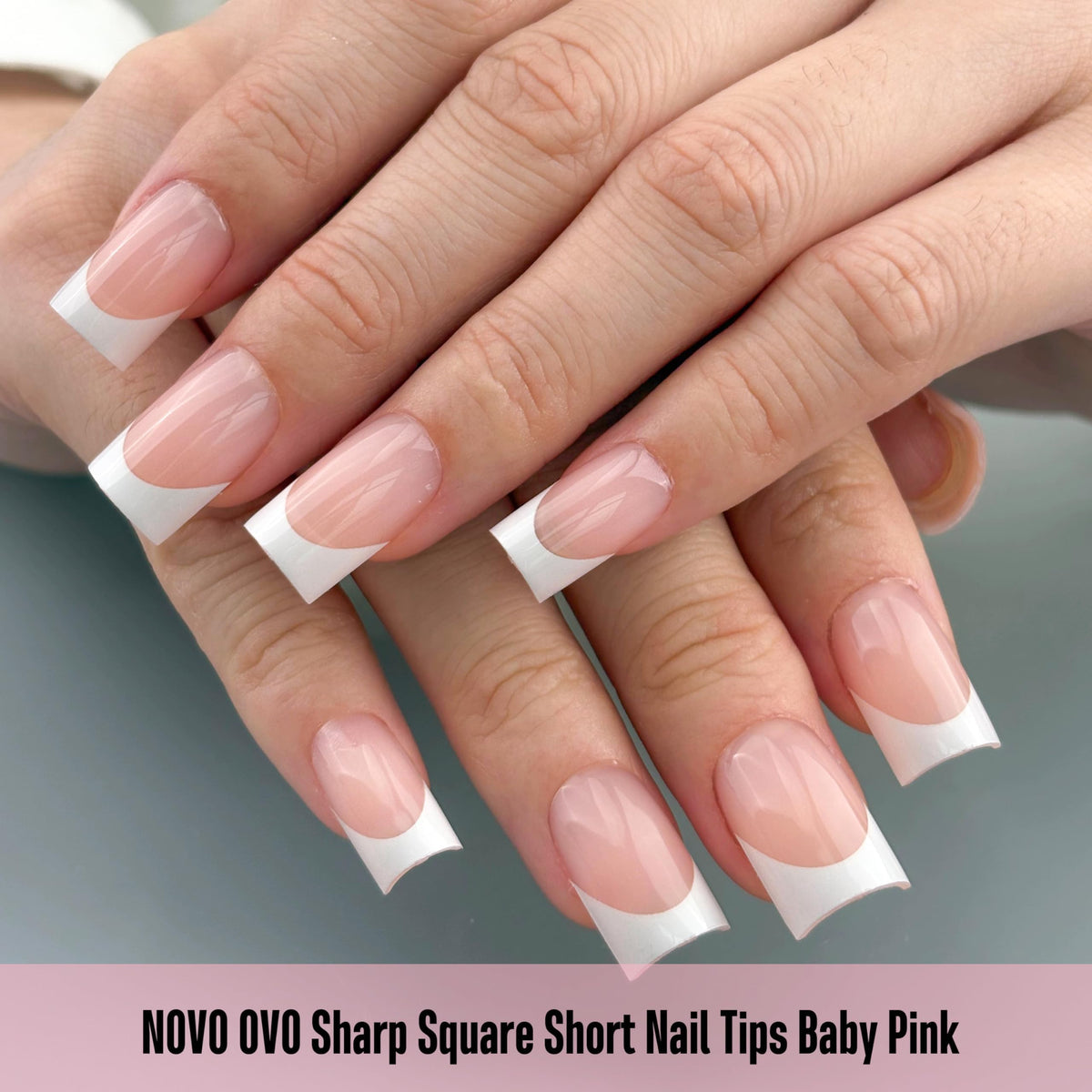 NOVO OVO close-up of crisp white French tip detail, precise pre-designed pattern benefit