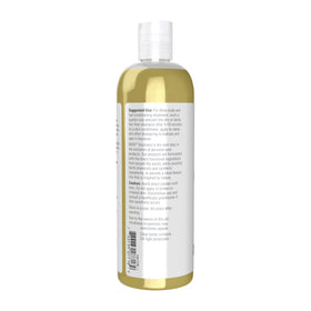 NOW Foods jojoba oil next to common objects to show 16-ounce size and value