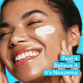 Noxzema travel jar inside toiletry bag, brand ensures cleansing on the go