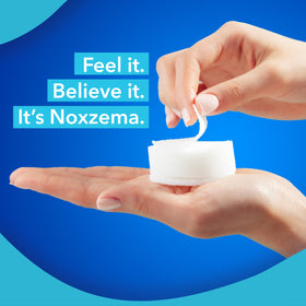 noxzema bottle held to show size and travel-friendly scale
