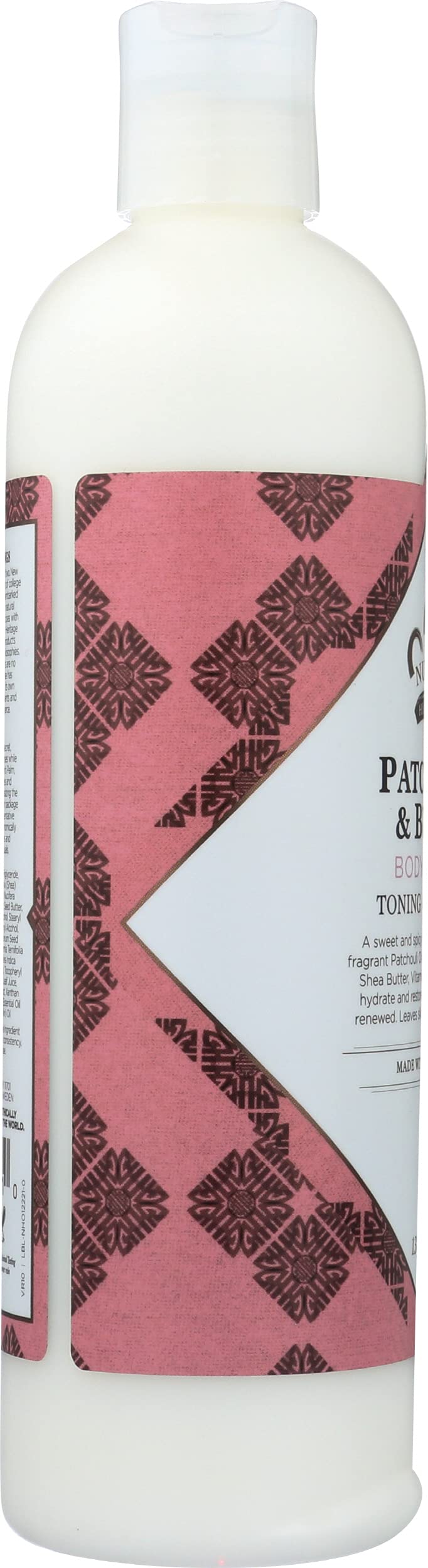 Nubian Heritage dispensing lotion onto hand demonstrating easy spreadability and quick absorption
