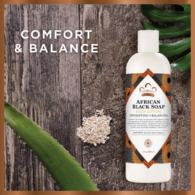 Nubian Heritage lotion texture swipe showing silky absorbent finish