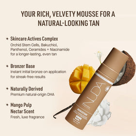 Nuda BronzeFoam being applied with tanning mitt demonstrating streak-free, even coverage