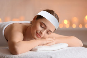 Nujzuir headband held in hand showing size and stretch for fit
