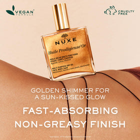 NUXE applying oil to hair ends to smooth frizz and add glossy shine