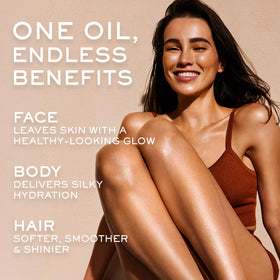 NUXE running oil through hair ends for frizz control and shine