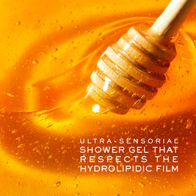 NUXE honey and sunflower ingredients beside bottle, emphasizes natural care