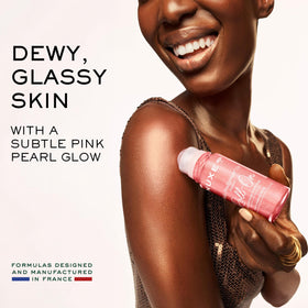 NUXE oil texture on skin with pink-gold shimmer delivering luminous finish