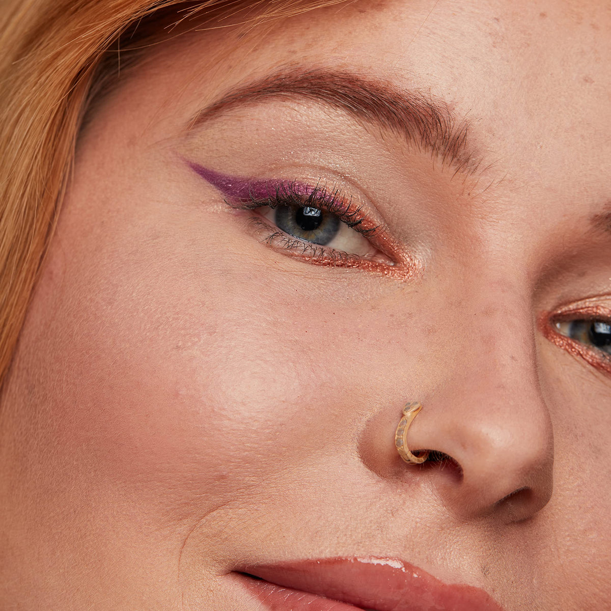 NYX PROFESSIONAL MAKEUP pencil held in hand to show compact travel-friendly scale