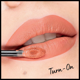 NYX Professional Makeup swatch on arm showing Turn-On peach nude payoff and blendable finish benefit color accuracy