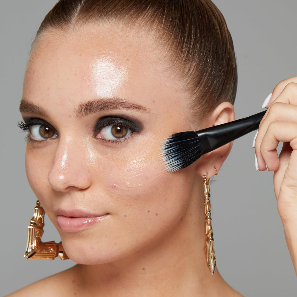 NYX PROFESSIONAL MAKEUP primer beside foundation illustrating seamless base without color shift