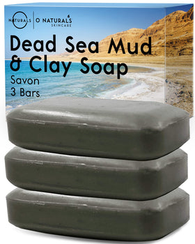 O NATURALS front packaging showing three Dead Sea soap bars, clear ingredient callout, travel-ready benefit