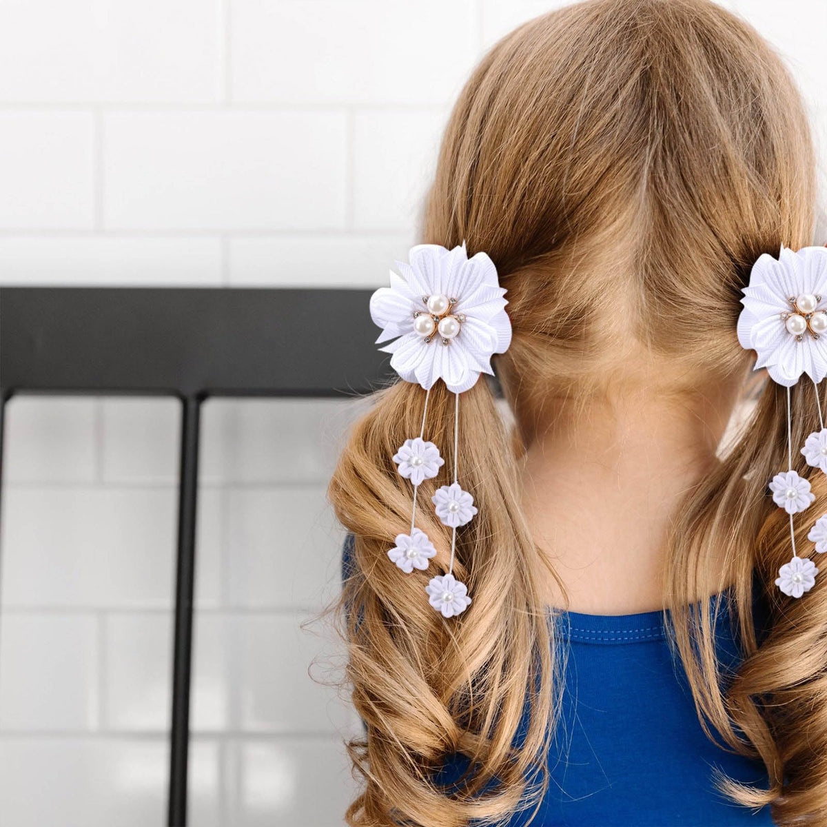 OAOLEER bow clipped into toddler pigtails, tidy look for school and play